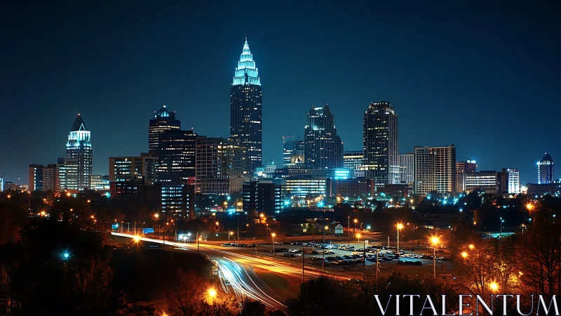 Modern skyscrapers glow over a vibrant city at night.