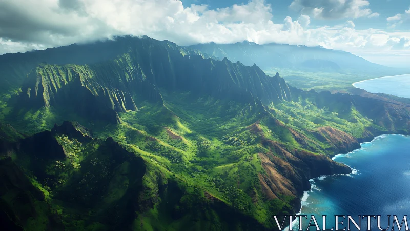 Coastal mountain range meets ocean under scattered clouds