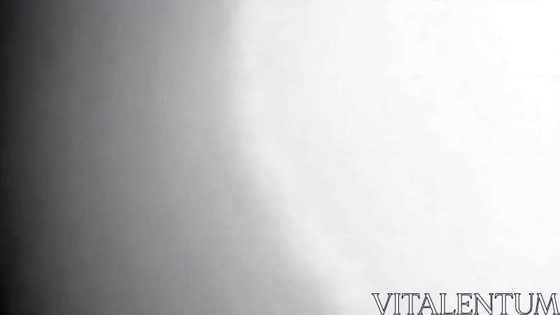 Monochrome gradient surface with soft lateral light transition.