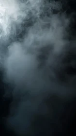 Thick white smoke swirling in dark empty background.