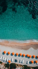 Turquoise shoreline with vivid orange parasol rhythm