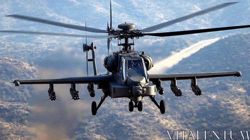 Attack helicopter captured front-on over mountainous terrain