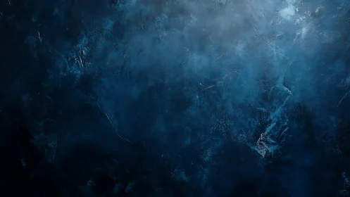 Deep indigo textured backdrop with diffused studio lighting.