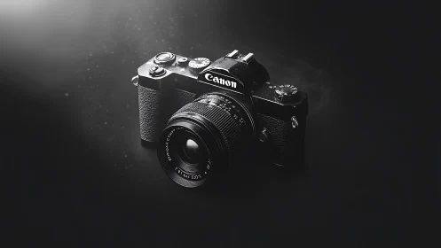 Vintage Canon Camera with Classic Lens in Dramatic Monochrome