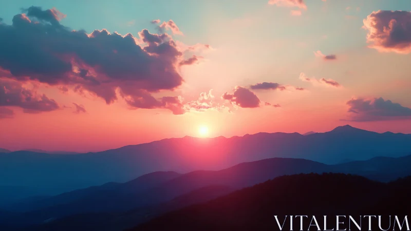 Sun descends over layered mountain ridges and distant clouds