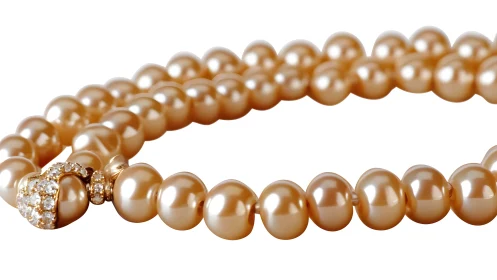 Elegant Golden Pearl Necklace with Diamond Clasp on White Background.