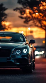 Luxury coupe glows against vivid sunset city backdrop.