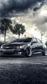 Storm‑ready slammed Chevy prowling under bruised skies.