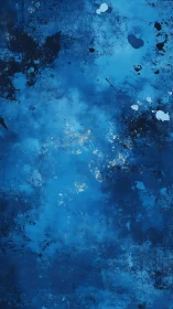 Abstract blue textured surface shows layered paint and wear