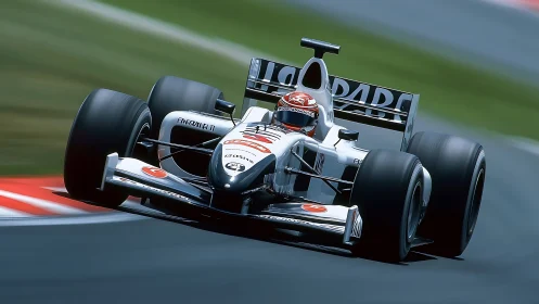 Silver bullet slingshots through a sunlit racing chicane