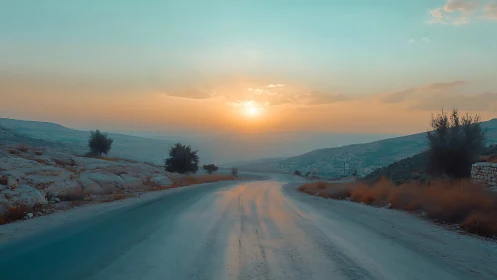 Sunlit rural road winding through tranquil desert hills.