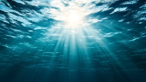 Sunbeams cascade through tranquil blue ocean water