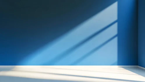 Sunlit blue wall with strong window shadow lines in corner