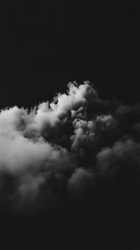 Monochrome cumuliform cloud mass in high-contrast chiaroscuro study.