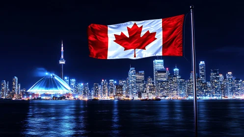 Canadian flag above illuminated Toronto skyline at night.