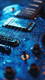 Electric guitar body with water droplets in close focus.