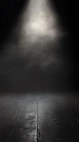 Lone theater spotlight kissing a moody wooden stage floor.