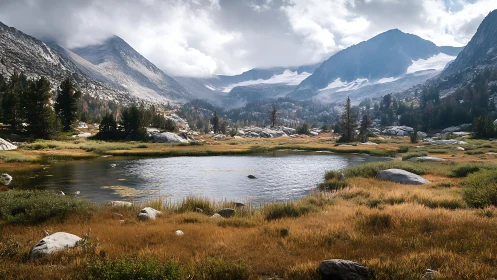 Alpine lake below rugged granite peaks in early autumn.