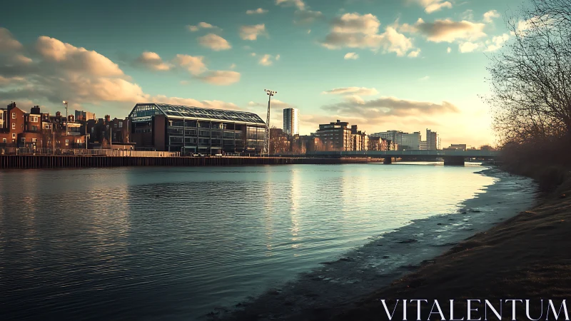 Sunlit urban riverscape with modern glass warehouse architecture.
