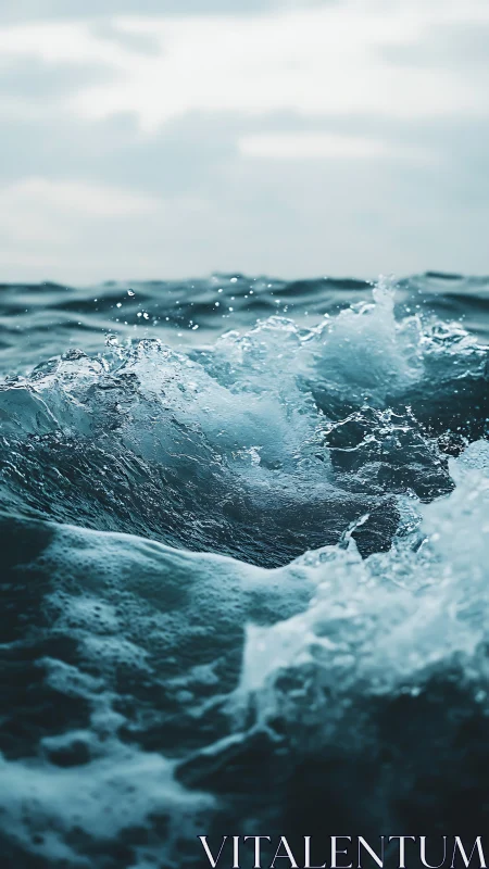 Ocean surface shows breaking wave with visible water motion