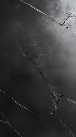 Dark cracked marble texture with subtle smoky gradients.