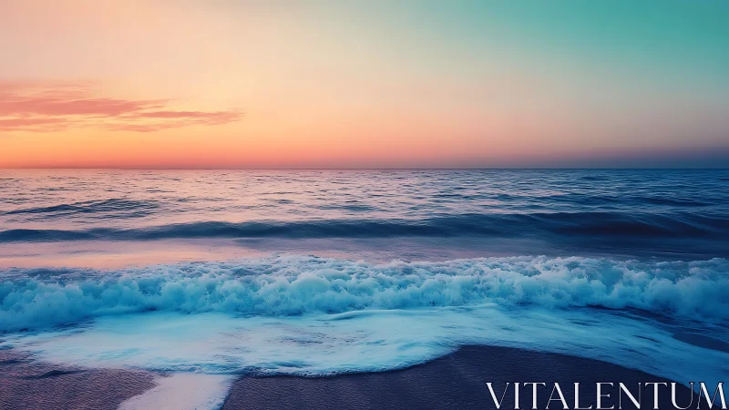 Ocean waves roll onto shore under gradient sunset sky