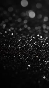 Gentle silver sparkles glowing softly in the dark night.