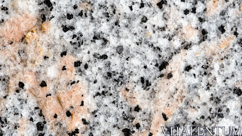 Granite surface shows speckled pink, white and black minerals