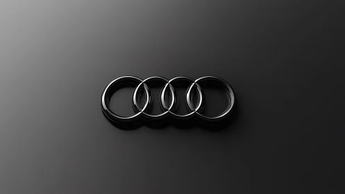 Gleaming chrome rings drift across a midnight graphite void.