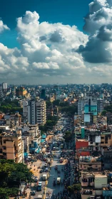 High angle urban boulevard under towering cumulus clouds