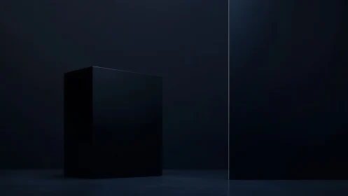 Minimal black rectangular block in dark studio space.