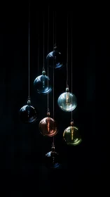 Suspended glass orbs glowing softly in deep shadowed space.