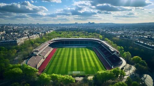 Urban football stadium within dense city landscape panorama.