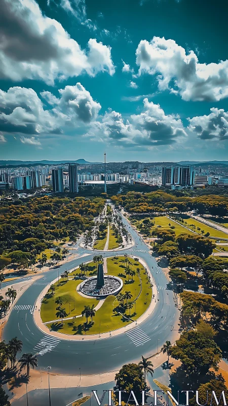 Sunlit city roundabout winding through lush urban parklands.