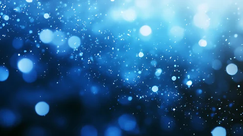 Blue bokeh particles drift through softly glowing space