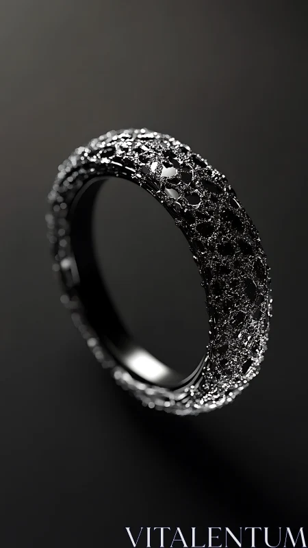 Textured black metal ring rendered against dark background
