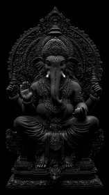 Dark monochrome Ganesha sculpture shows ornate divine presence