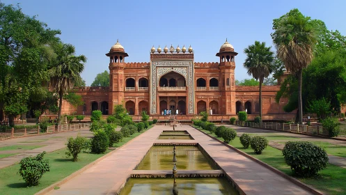 Sunlit Mughal gateway serenading formal gardens in stone.