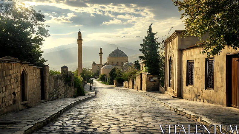 Sunlit cobblestone street leads toward distant hilltop mosque