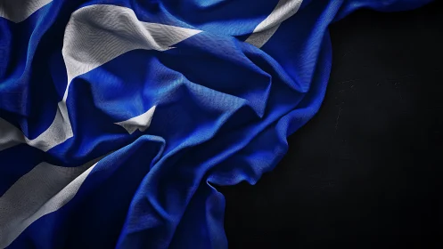 Closeup of wrinkled blue and white saltire style flag.