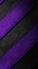 Macro inspection of diagonal black and violet woven textile bands.