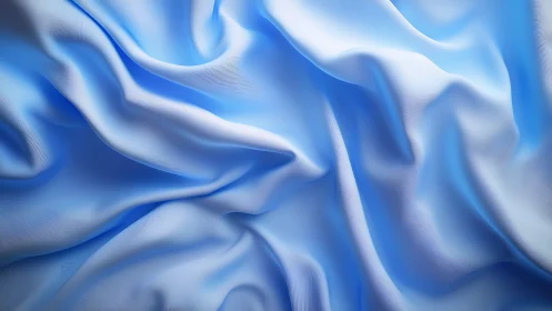 High-resolution draped light blue satin fabric folds closeup
