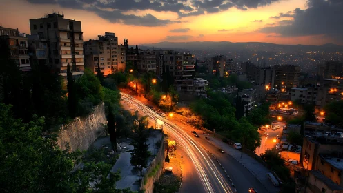 Long-exposure urban highway at dusk through dense hillside city