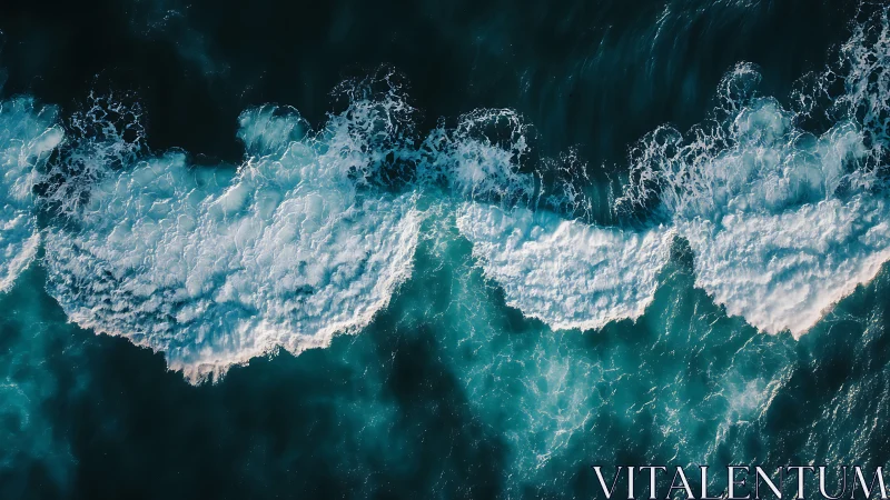 Cresting teal waves sketch bright foam ribbons from above