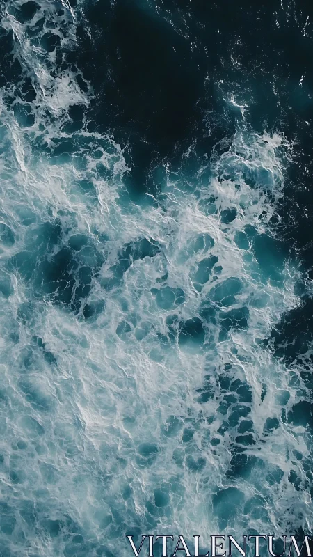 Turbulent ocean surface shows foaming white waves and dark water