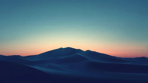 Silent blue dunes cradle a slow-burning desert sunrise