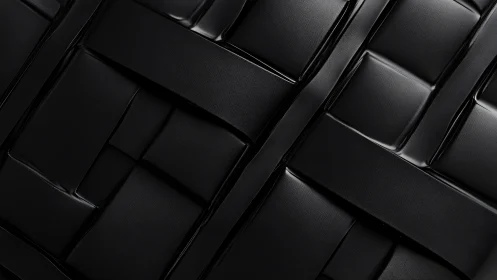 Geometric black leather weave in close-up minimal abstraction.