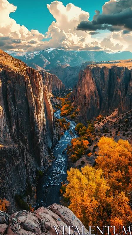 Golden canyon river winds gently beneath glowing autumn cliffs
