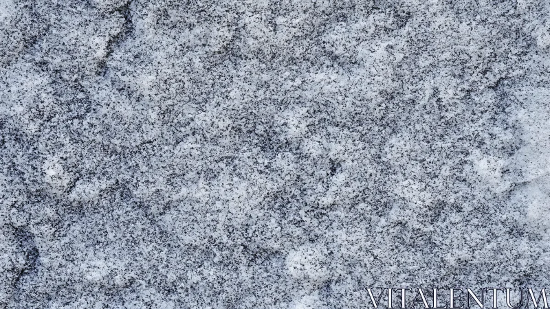Close-up of rough granite stone texture in natural gray tones.