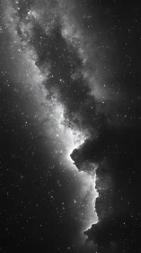 Monochrome stellar rift cutting through dense star field.